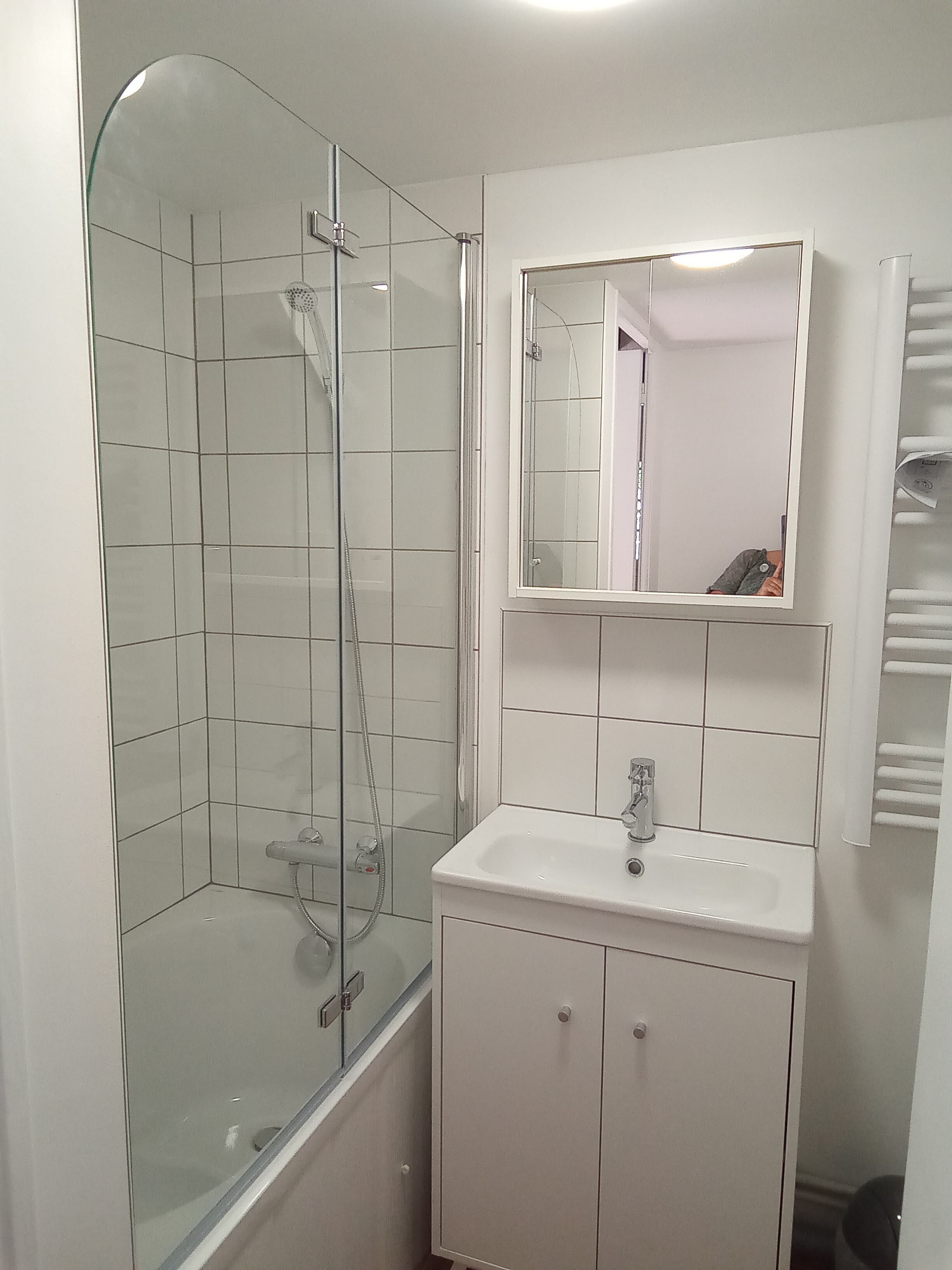 Bathtub, hair dryer, towels, soap