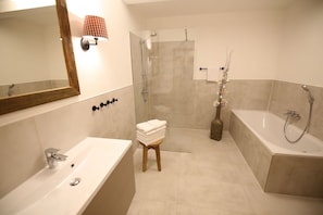 Combined shower/tub, hair dryer, towels, toilet paper