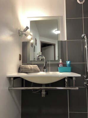 Shower, hair dryer, towels, soap