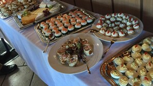 A buffet table with various food items including sushi, pastries, and deviled eggs. - Gaststätte und Pension Frankenstube (Nidda)