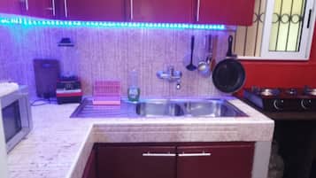 Fridge, microwave, stovetop, coffee/tea maker