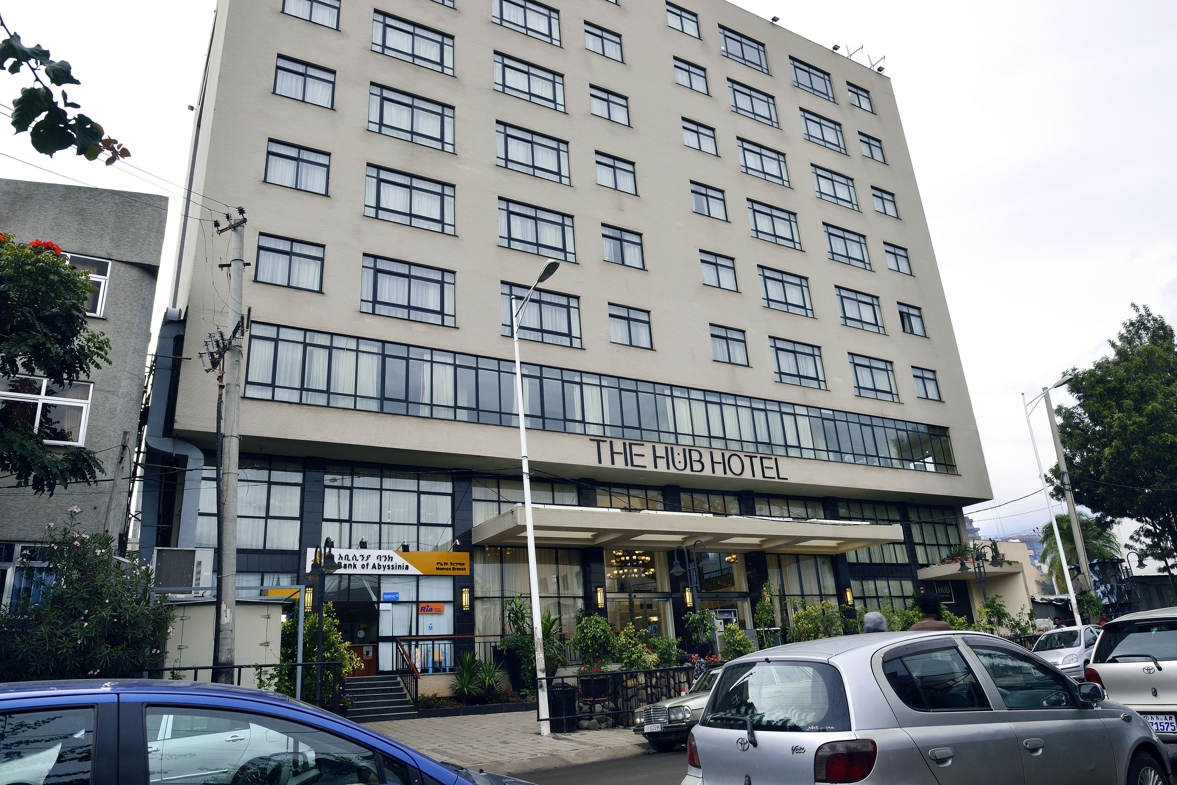 A multi-story hotel with a prominent entrance and signage for 'The Hub Hotel'.