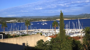 A marina with numerous sailboats docked, surrounded by greenery and a clear blue sky. - DUPLEX WITH GARAGE BETWEEN BEACHES AND TOWN CENTER (La Ciotat)
