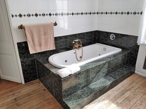 Bathtub, hair dryer, towels, soap