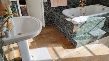 Bathtub, hair dryer, towels, soap