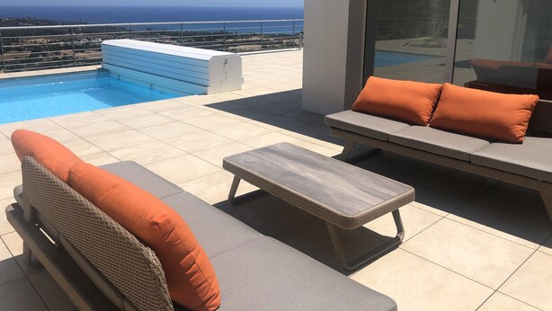 A rooftop terrace with a pool, outdoor seating, and a view of the ocean. - Superb architect villa (TERTENIA DI MARINA)
