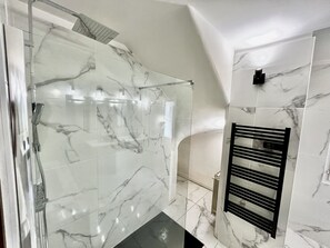 Combined shower/tub, hair dryer, towels, toilet paper
