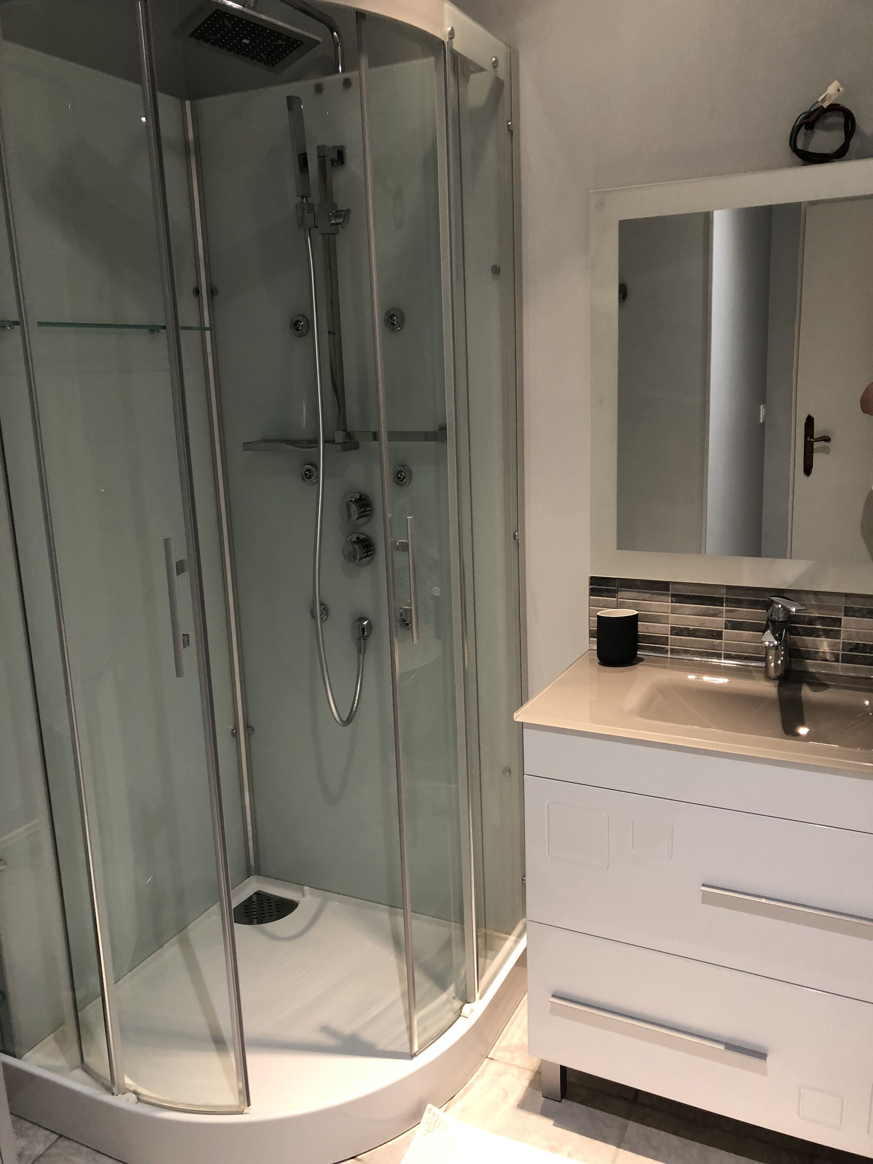 Combined shower/tub, hair dryer, towels, toilet paper