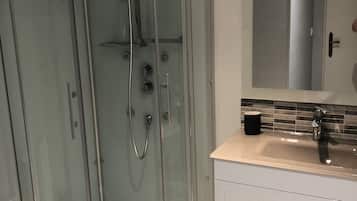 Combined shower/tub, hair dryer, towels, toilet paper