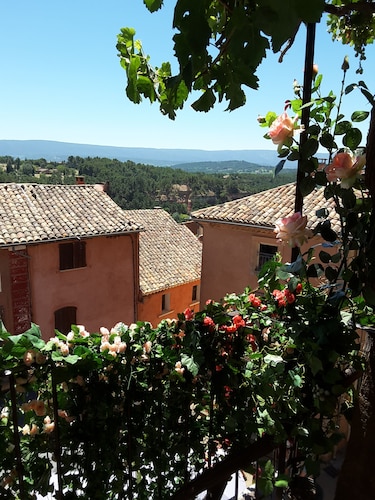 "LA DAME AU BALCON" on the village square