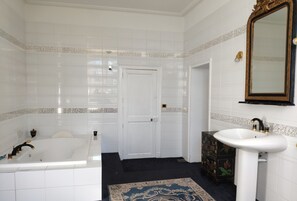 Bathtub, hair dryer, towels, soap