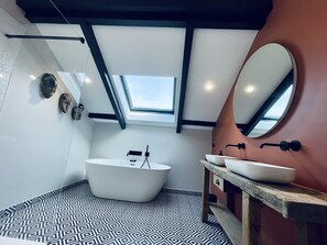 Bathtub, hair dryer, towels, soap