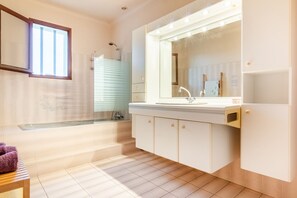 Combined shower/tub, hair dryer, towels, soap
