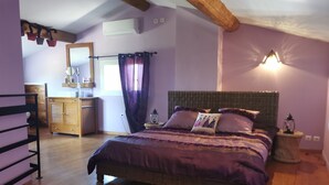 A bedroom with a large bed, wooden floor, and a dresser. - VILLA "La Crau" Exceptional Provencal oasis with private saltwater pool  (Arles)