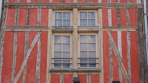 A building facade with a timber frame and a red and white color scheme. - Cottages to Orient - Chalet Lac (Géraudot)