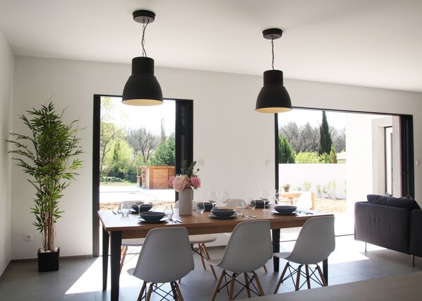 Enjoy meals in this stylish dining area with a large table and comfortable seating for four.
