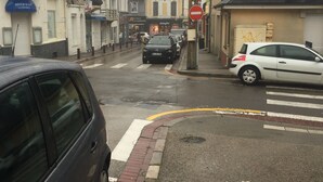A street view with a restaurant, hotel, and a building with a sign reading "L'IMPÉRATRICE".
