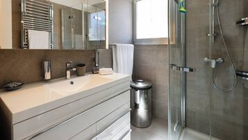 Shower, hair dryer, towels, soap