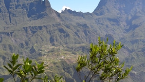 A mountainous landscape with a valley in the foreground and a village below. - cccccccccc (Fontaine-De-Vaucluse)