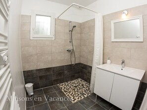 Shower, hair dryer, towels, toilet paper