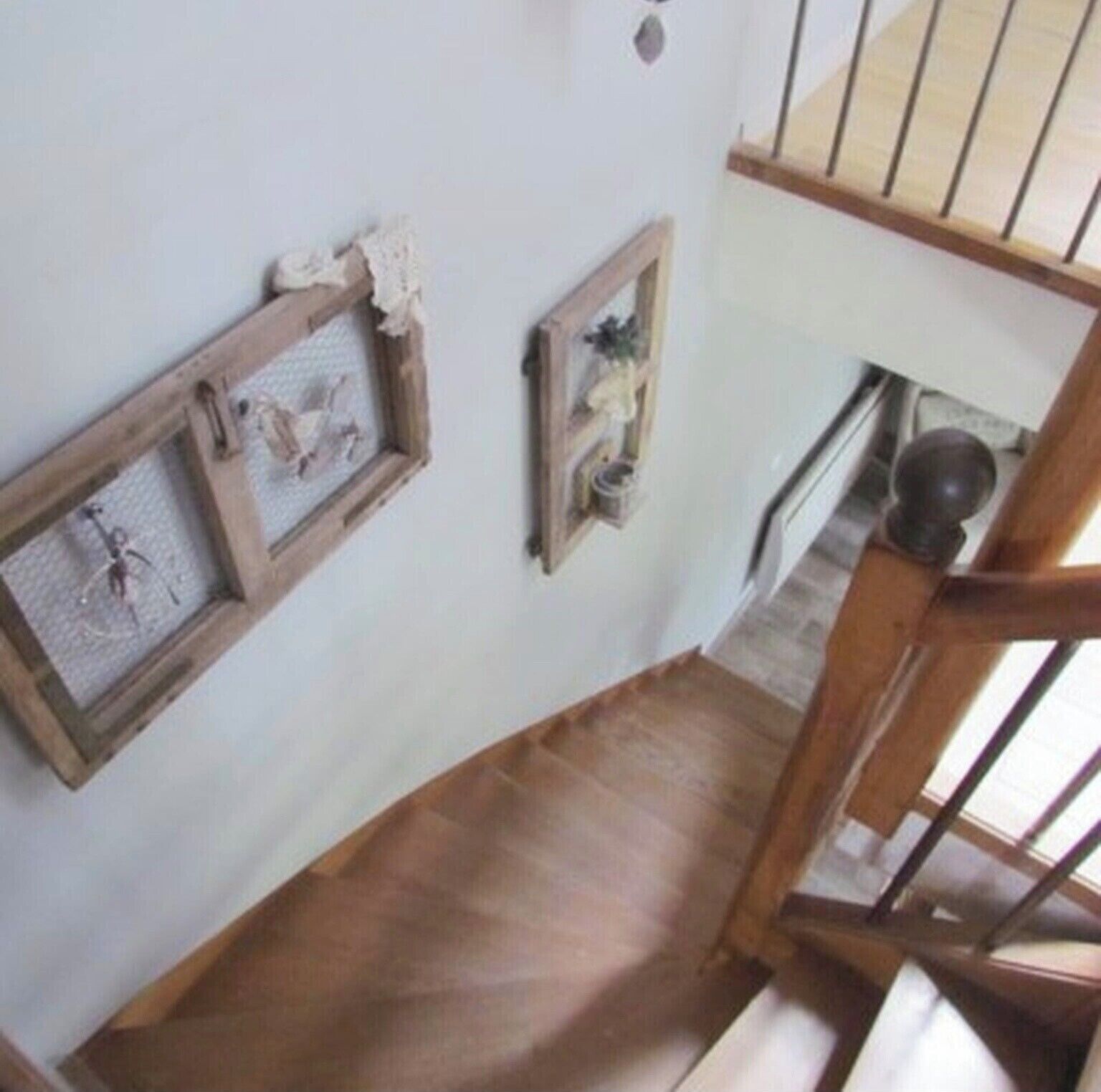 A staircase with wooden railings and a wooden floor.