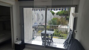 A room with a sliding glass door leading to an outdoor patio area.