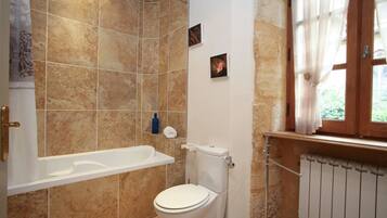 Bathtub, hair dryer, towels