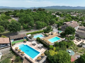 Outdoor pool, a heated pool - Stone cottage, swimming pools, playground, enclosed gite village with trees (Joyeuse)