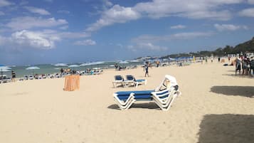 On the beach, sun-loungers, beach towels