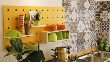 Fridge, paper towels, dining tables
