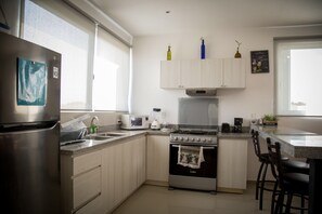 Microwave, oven, coffee/tea maker, cookware/dishes/utensils