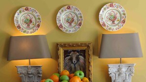 A wooden desk with a bowl of fruit, two lamps, and a framed picture. - Beautiful  countryhouse in rural surroundings with pool and pool house.   (Grignan (Drome Provencale))
