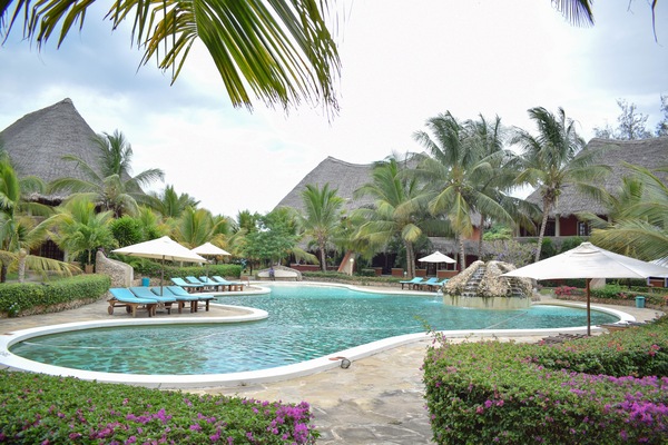 Enormous swimming pool with waterfall