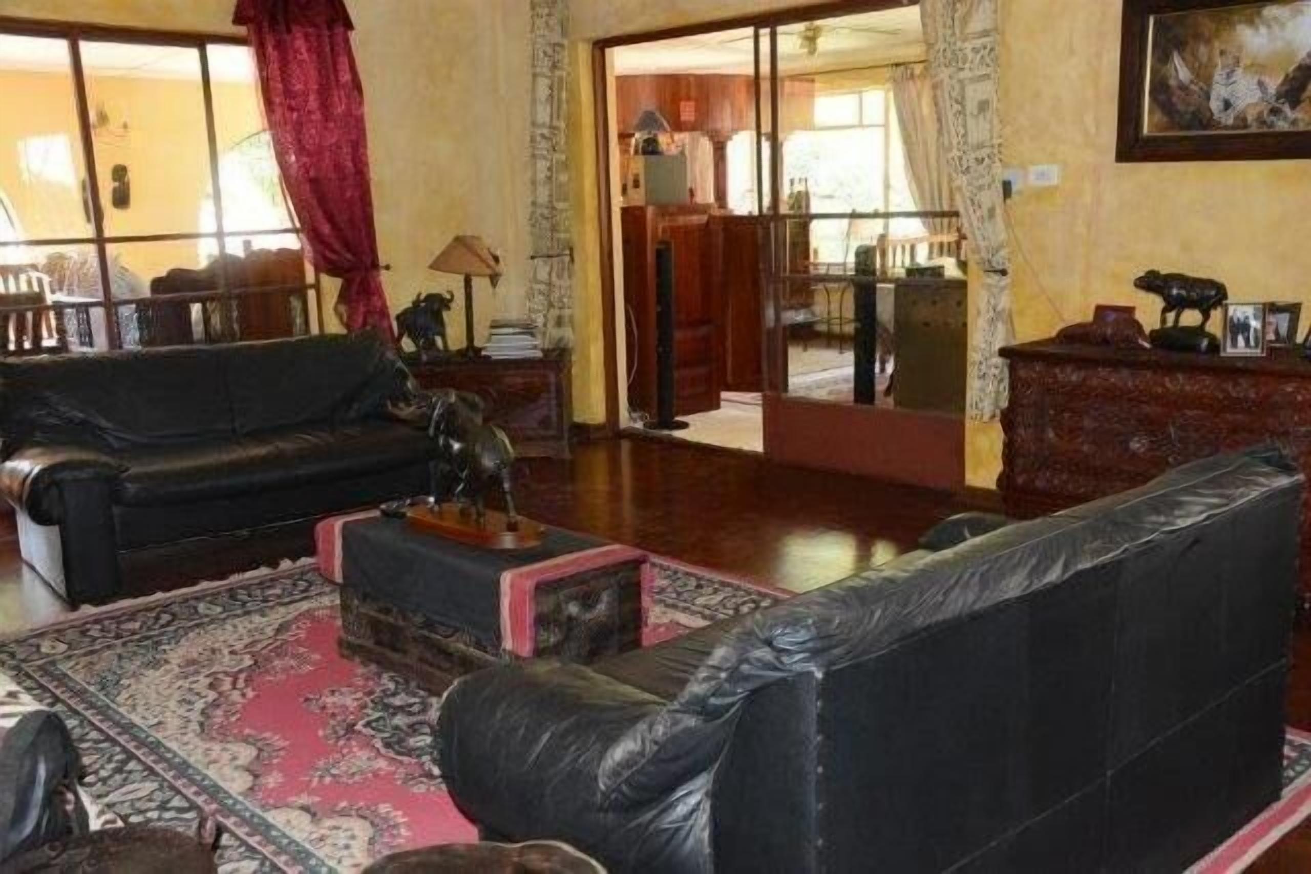 Main Lounge leading out to bar, TV and second lounge area
