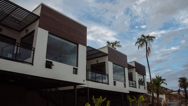 A modern multi-story building with large windows and a flat roof. - The Best Vacation Place in the Heart of Ensenada with Panoramic view (Ensenada)