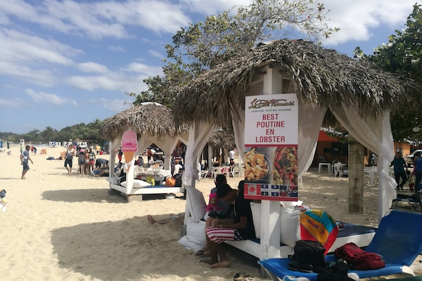 On the beach, sun loungers, beach towels