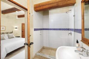 Shower, hair dryer, towels, toilet paper