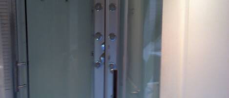 A glass door with a metallic handle and a keyhole.
