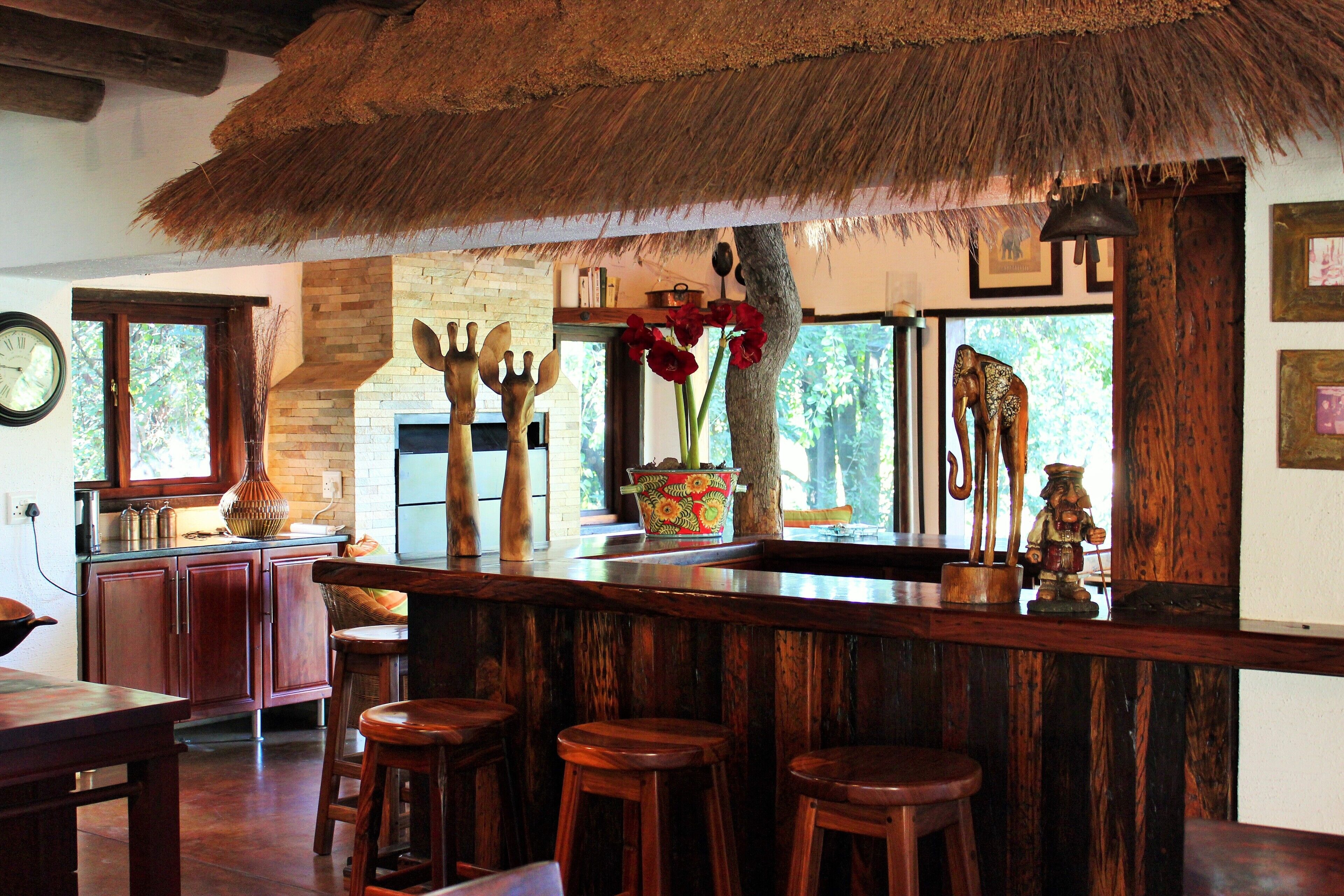 Bar area leading onto sitting room with indoor gas fireplace/barbecue.