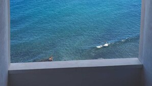 A view of the ocean with a cruise ship in the distance.