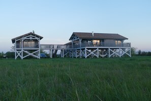 A two-story house with a balcony and a separate garage. - House / Villa - Talais (Talais)