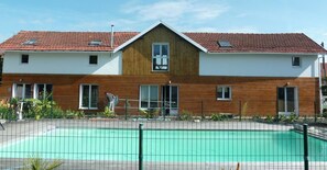 Seasonal outdoor pool, pool umbrellas, pool loungers