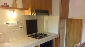 Unclassified image, 2 of 19, button - Studio with outdoor table in the green (Marciana Marina)