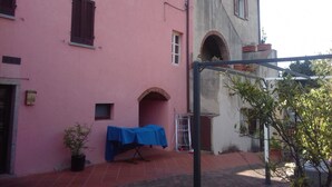Unclassified image, 5 of 19, button - Studio with outdoor table in the green (Marciana Marina)