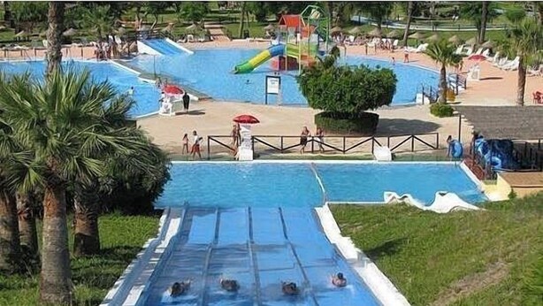 A water park with multiple slides and pools.