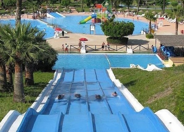 A water park with multiple slides and pools. - 3-Bedroom Holiday Home Wifi Communal Pool Walking Distance To Beach &Restaurants (Cabo Roig)