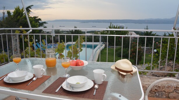 A dining table with breakfast items and a view of the sea. - Bay View Villa I in Crete with private swimming pool and modern convenient (Chania)