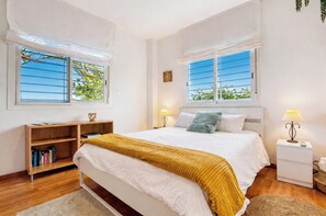 A bedroom with a bed, bedside tables, a desk, and a bookshelf. - VillaSense Luxury | Golf, Pool & Nature | Seville (Guillena)