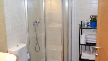 Shower, hair dryer, towels, toilet paper