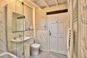 Combined shower/tub, hair dryer, towels, soap -  A stylish cottage, in the heart of the delightful  village of Grosmont  (Grosmont, Whitby, North Yorkshire)